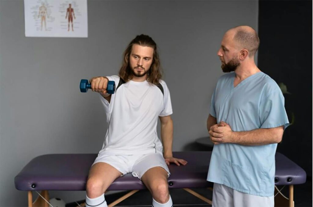 A man and a woman talking to a physical therapist.